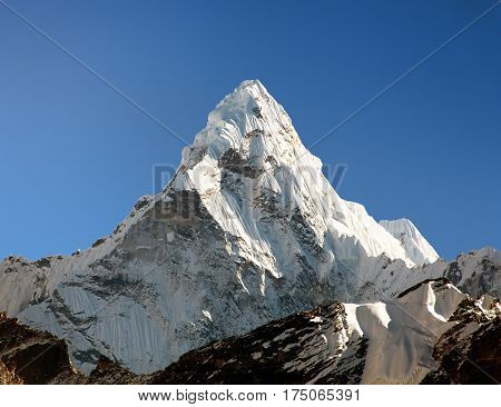 View of Ama Dablam on the way to Everest Base Campb with blue sky Sagarmatha national park Khumbu valley Nepal