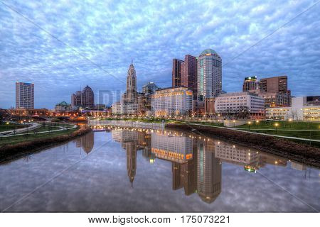 Evening Columbus Ohio skyline with thousands of clouds along the Scioto River at dusk