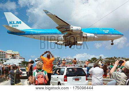Big Plane Landing Under Heads Of People