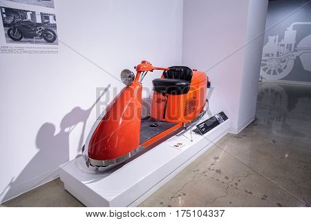 Los Angeles CA USA -- March 4 2017: Orange 1947 Salsbury Model 85 Streamlined scooter from Bill Kling at the Petersen Automotive Museum in Los Angeles California United States. Editorial only.