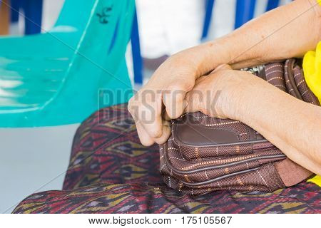 closeup hand of old asian woman suffering from leprosy amputated hand