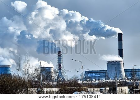 the thick smoke belching from factory chimneys