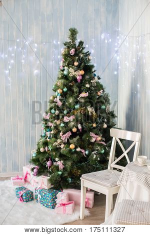 Christmas toys on a Christmas tree under snow