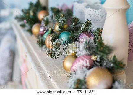 Christmas toys on a Christmas tree under snow