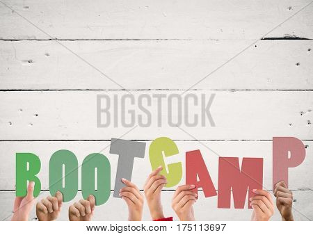 Digital composite of Hands holding bootcamp word