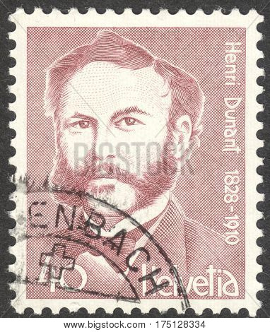 MOSCOW RUSSIA - CIRCA FEBRUARY 2017: a post stamp printed in SWITZERLAND shows a portrait of Henri Dunant a philantropist the founder of the Red Cross the series 