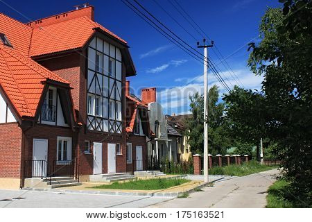 MORSKOE, KALININGRAD REGION, RUSSIA - JUNE 19, 2011: New cottages in the style of half-timbered houses in the Morskoe (Pillkoppen) village in the Curonian Spit National Park. Russia.