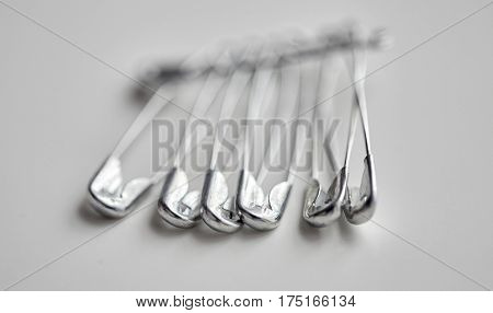 needlework and tailoring concept - sewing pins