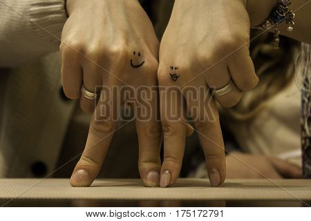 Two hands of lovers cringe at their wedding
