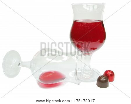 red wine in glass goblets and chocolate sweets