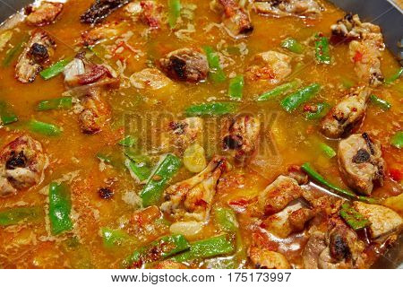 Paella from Spain recipe process ad water to get the broth boil