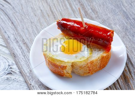 pinchos pintxos chistorra with quail egg tapas from Spain sausage food