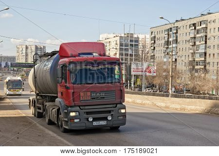VOLGOGRAD - MARCH 5: A truck with a tank for transportation of petroleum products rises on the bridge. March 5 2017 in Volgograd Russia.