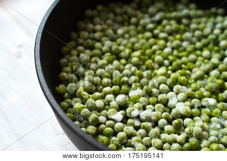 Green beans mung beans in a saucepan on the boards closeup horizontal