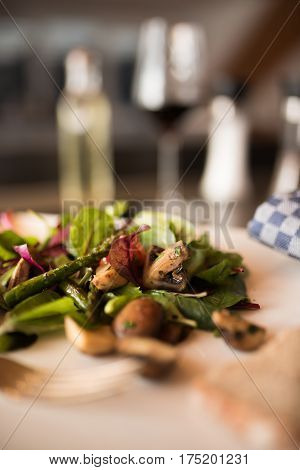 Fresh salad with asparagus and mushrooms and short depth of field