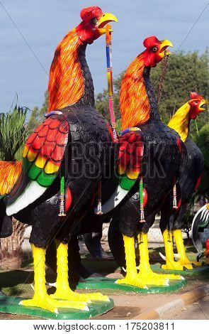 Rooster statues offerings at buddhist Wat Yai Chai Mongkhon temple in Ayutthaya, Thailand