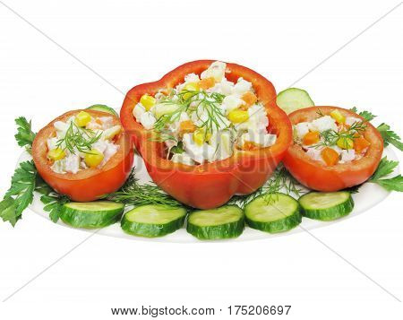 stuffed red pepper and tomato with parsley and fennel on the plate