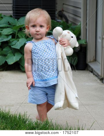18 Month Old Holding Teddy Bear Blanket Outside