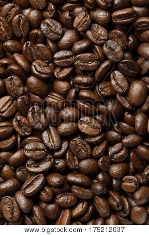 Abstract roasted coffee beans background. Macro photo