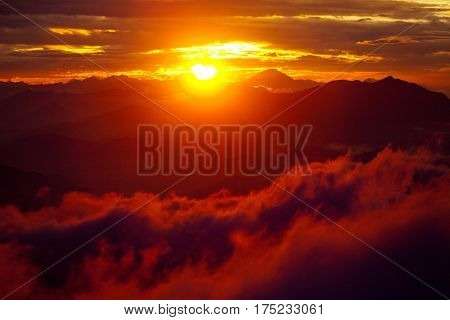 Gosaikunda area Orange sunset above mountain in valley Himalayas mountains