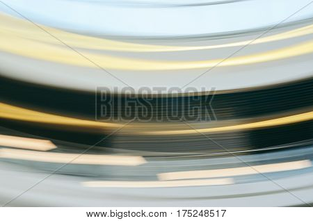 Colorful horizontal motion blur texture for background. Abstract light effects of public interior by low speed shutter and long exposure shot.