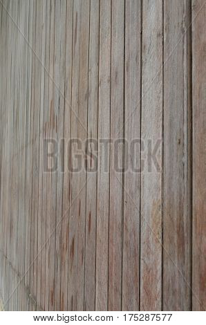 Side view of brown wood slat wall fasten with nail for background and texture