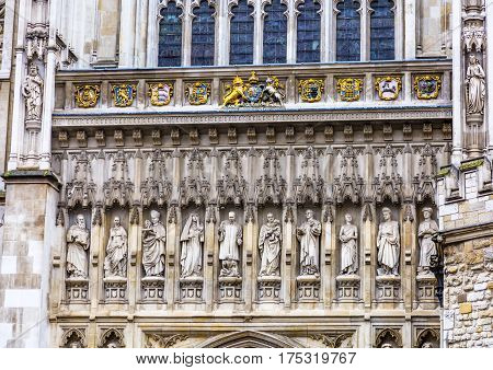 LONDON, ENGLAND - JANUARY 16, 2017 Christian Martyr Statues Above Door Facade Westminster Abbey Church London England. Statues include Martin Luther King/USA and Wang Zhiming/China. Decidcated June 9 1998.