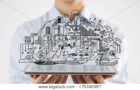 Businessman hand demostrating business strategy plan on tablet screen
