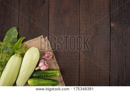 Ripe vegetables on an old wooden table. Top view.