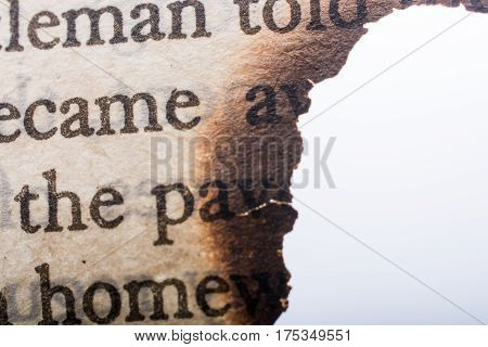 Burnt Texted Paper  On A White Background