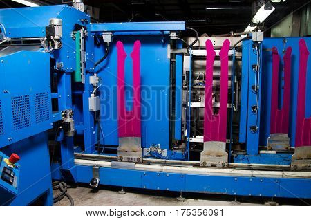 Cotton Yarn Production in a Textile Factory.Textile fabric manufacturing machines in work. Hoisery
