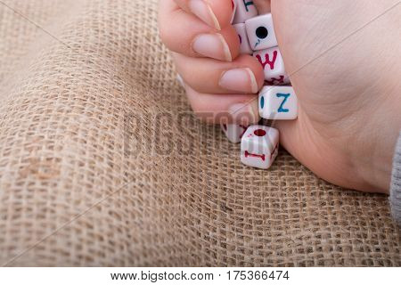 Colorful Alphabet Letter Cubes In Hand