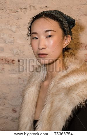 MILAN ITALY - FEBRUARY 25: Gorgeous model poses in the backstage just before Cividini show during Milan Women's Fashion Week on FEBRUARY 25 2017 in Milan.