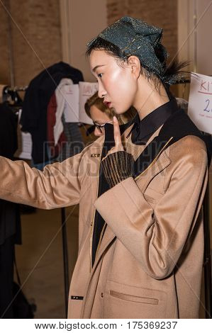MILAN ITALY - FEBRUARY 25: Gorgeous model poses in the backstage just before Cividini show during Milan Women's Fashion Week on FEBRUARY 25 2017 in Milan.