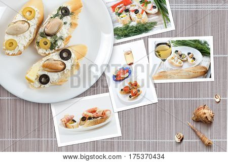 Beautiful snapshots of various italian sandwiches with seafood arranged on rustic wooden background with plates with food and seashells with copy space horizontal top view.