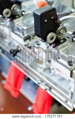 Machinery and equipment in a spinning production company interior design. Hoisery factory. Textile fabric. Shaping socks