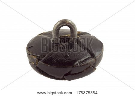 Old leather clothes button isolated on white background
