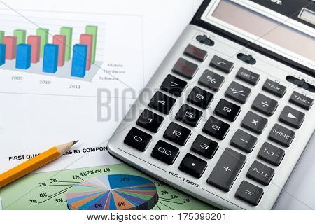 Caclulator and Pencil on the Document with Graph - Close Up