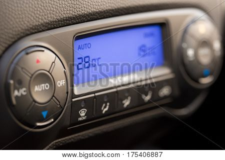 Closeup of Modern Air Conditioning and Heating Control Panel of a Car