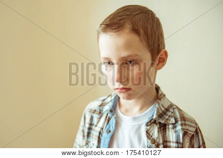 Teen boy sad, upset, ready to cry