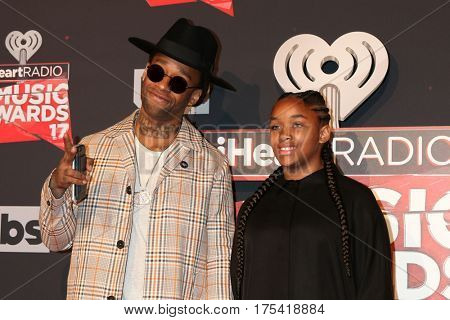 LOS ANGELES - MAR 5:  Ty Dolla Sign, daughter at the 2017 iHeart Music Awards at Forum on March 5, 2017 in Los Angeles, CA