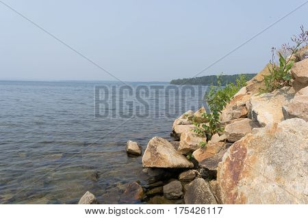 Rocky coast of the lake Uvildy. Russia Summer South Ural