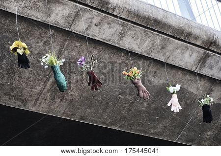 colourful flowers in gloves hanging in the air