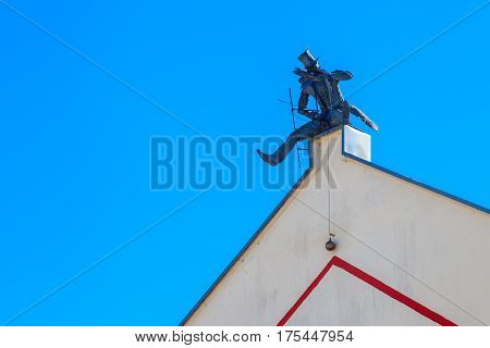 Klaipeda, Lithuania - July 20, 2016: Chimney Sweeper Sculpture On Roof In Old Town Of  Klaipeda, Lit