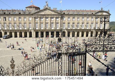 SANTIAGO DE COMPOSTELA, SPAIN - AUGUST 5, 2016: Pilgrims on the Plaza of Obradoiro in Santiago de Compostela Galicia Spain