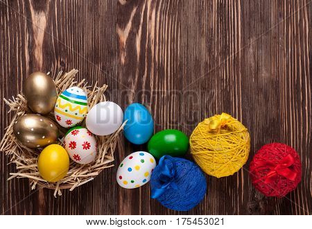 Colorful easter edds on a brown wooden table