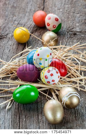 Colorful easter edds on a old wooden table