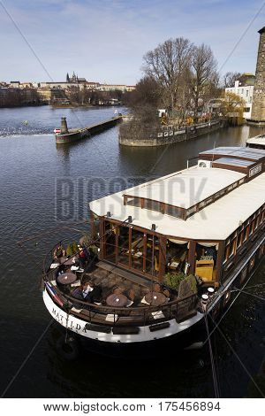 Prague, Czech Republic - March 3: Restaurant Boat Anchored In Front Of Manes Exhibition Hall On Marc