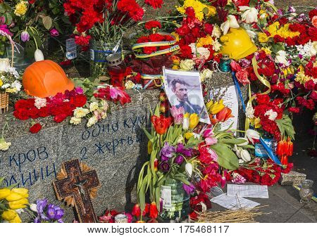 Kiev Ukraine - February 26 2014: Flowers photo and candles in Kiev on Maidan Square during the revolution in the Ukraine.
