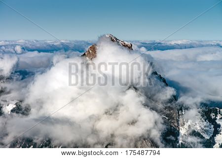 Beautiful Mountains In Snow. Evening Aerial View With Shadows.